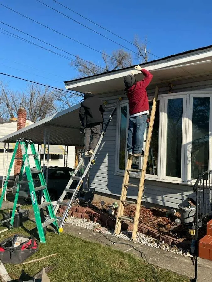 Restoration crew performing exterior repair in Adel